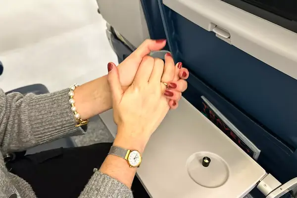 A person rubbing the Aēsop Reverence Aromatique Hand Balm into their hands