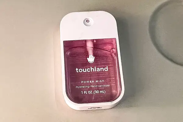 Touchland Power Mist Hand Sanitizer on a white surface