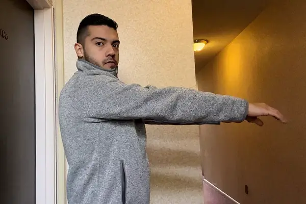 A person wearing the L.L.Bean Sweater Fleece Full-Zip Jacket with outstretched arms