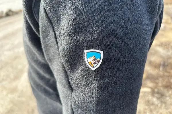 A close up of the logo on the sleeve of the KUHL Interceptr Full-Zip Jacket