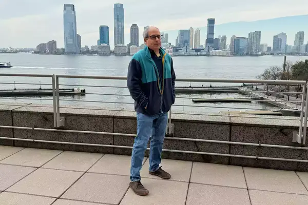 A person wearing the REI Co-op Trailmade Fleece outdoors