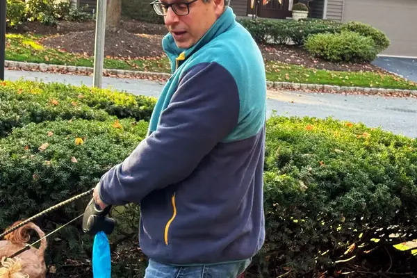 A person wearing the REI Co-op Trailmade Fleece outdoors