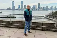 A person wearing the REI Co-op Trailmade Fleece outdoors