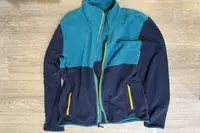 REI Co-op Trailmade Fleece on a wood floor