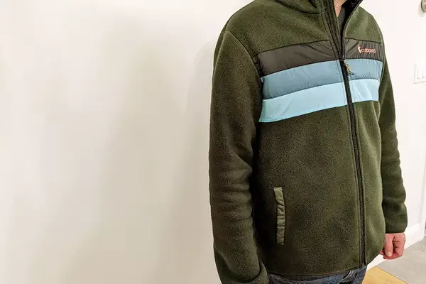 A person wearing the Cotopaxi Teca Fleece Full-Zip Jacket, front view