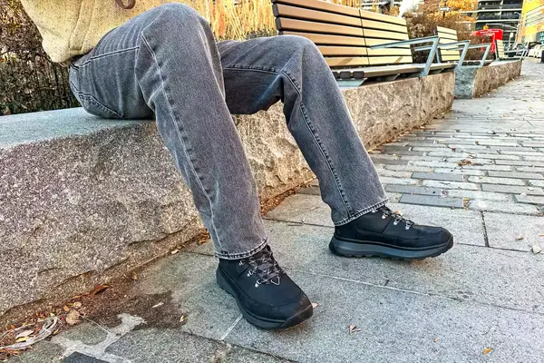 A person wears The North Face Men’s Bergen Leather Waterproof Boots outside