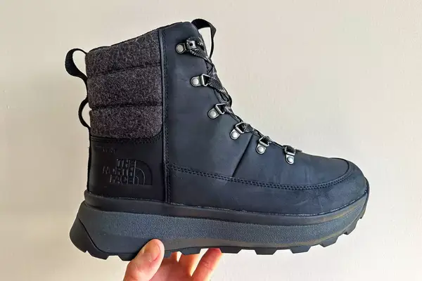 A person holds up The North Face Men’s Bergen Leather Waterproof Boot