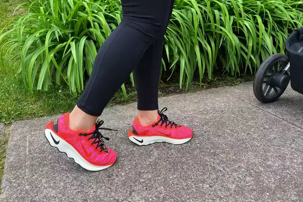 Feet wearing Nike Motiva Women