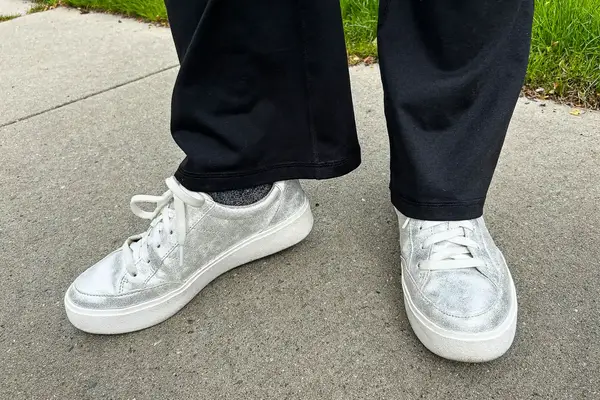 A person wearing Dr. Scholl