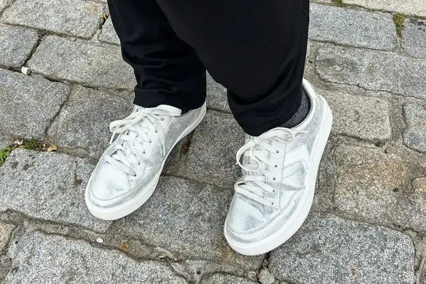 A person wearing Dr. Scholl