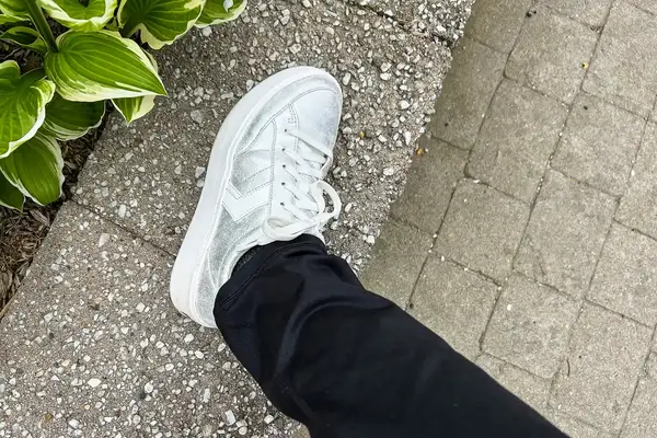 A person wearing Dr. Scholl