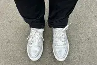 A person wearing Dr. Scholl