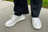 A person wearing Dr. Scholl