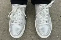 A person wearing Dr. Scholl