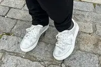 A person wearing Dr. Scholl