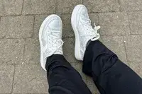 A person wearing Dr. Scholl