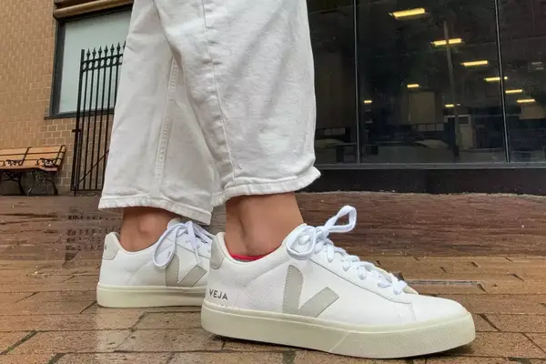 A side view of a person wearing the Veja Women