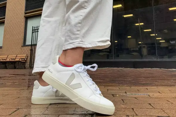 A person walks outside while wearing the Veja Women
