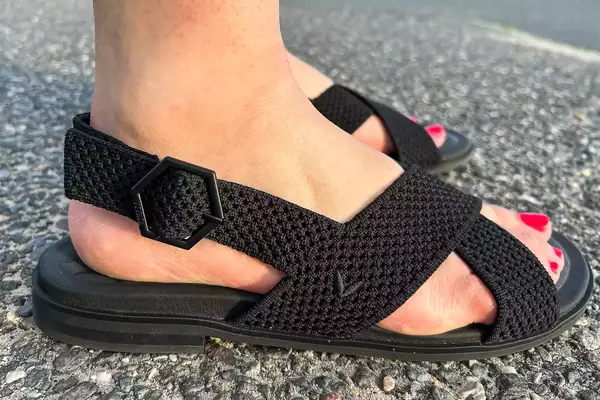 Side view of Person wearing Vivaia Arch Pro AdaptAll Sandals (Pamela).