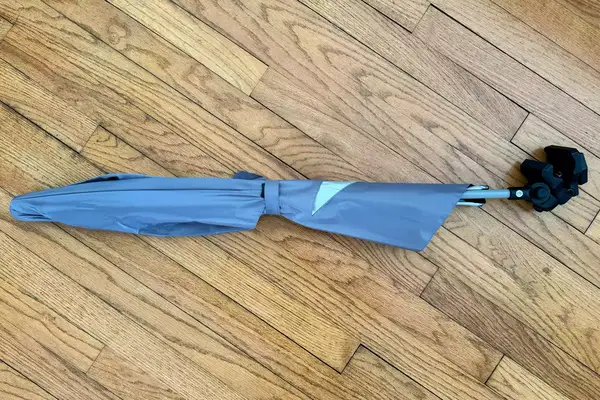 Closed Sport-Brella Versa-Brella on wood floor