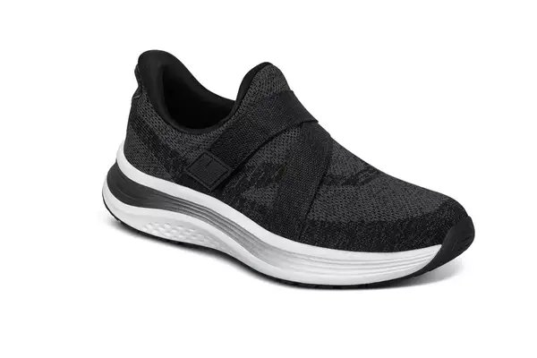 A person walks through grass while wearing the Seavees Women