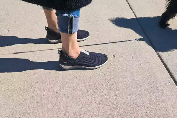 A person walks outside while wearing the Ryka Women