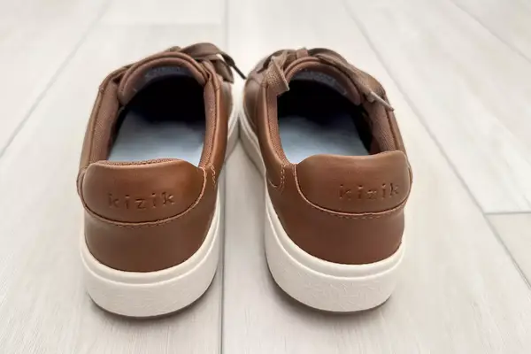 Kizik Women’s Vegas Sneakers on a wooden floor