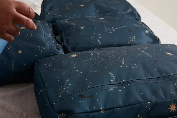 A person wears the Arden Cove Carmel Convertible Backpack and Crossbody like a backpack