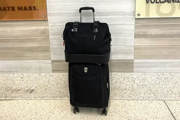 Béis Mini Weekender on top of a suitcase