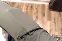 A close-up of a phone in the pocket of the Nomatic Outset Jogger