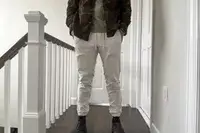 A person stands in a hallway while wearing the lululemon License to Train Jogger