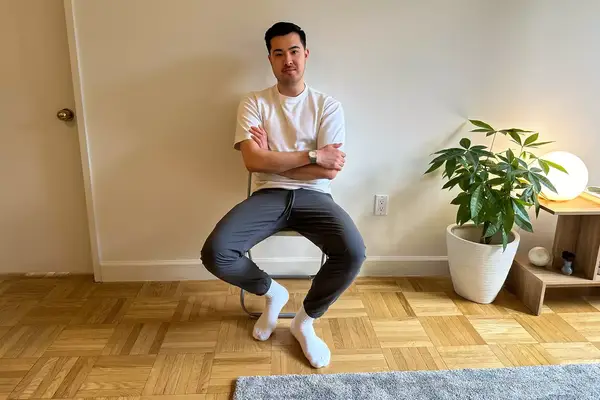 A person sits in a chair while wearing the Patagonia Men