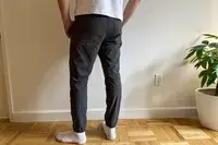 A person stands inside while wearing the Patagonia Men