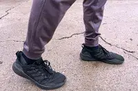 A person walks outside while wearing the Under Armour Men