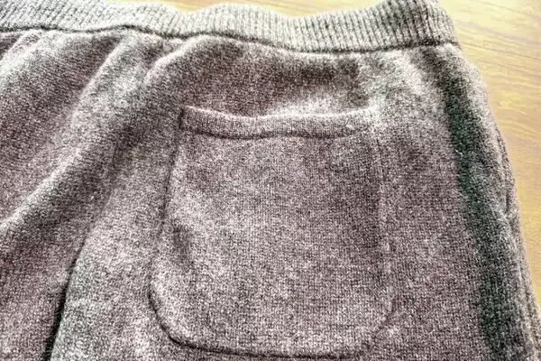 A close-up of the pocket on the Quince Mongolian Cashmere Jogger