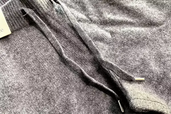 A close-up of two strings on the Quince Mongolian Cashmere Jogger