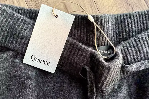 A close-up of the tag on the Quince Mongolian Cashmere Jogger