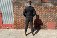A person looking at a wall while wearing the Quince Mongolian Cashmere Jogger