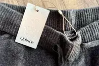 A close-up of the tag on the Quince Mongolian Cashmere Jogger