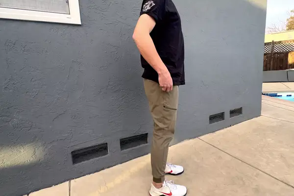 A person stands on a patio while wearing the Patagonia Men