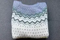 Fjallraven Ovik Knit Sweater on a grey surface