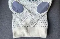 Fjallraven Ovik Knit Sweater on a grey surface