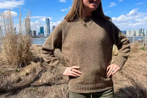 A person standing outside wearing the Finisterre Farne Women