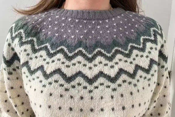 A closeup of a person wearing the Fjallraven Ovik Knit Sweater