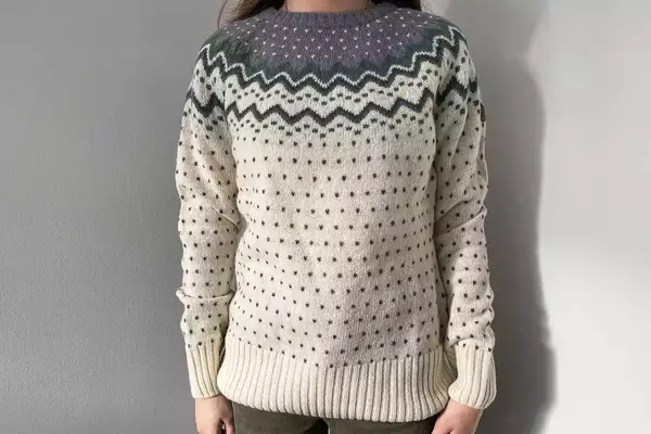 A person standing wearing the Fjallraven Ovik Knit Sweater