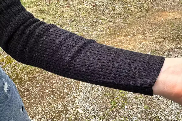 A close up of the sleeve of the Uniqlo Merino Ribbed Sweater