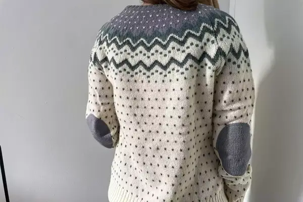 A person wearing the Fjallraven Ovik Knit Sweater