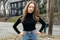 A person wearing the Uniqlo Merino Ribbed Sweater