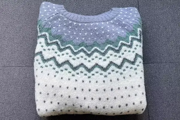 Fjallraven Ovik Knit Sweater on a grey surface