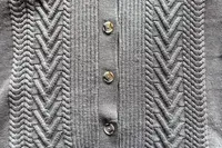 A close up of the Quince Australian Merino Wool Collared Cable Cardigan